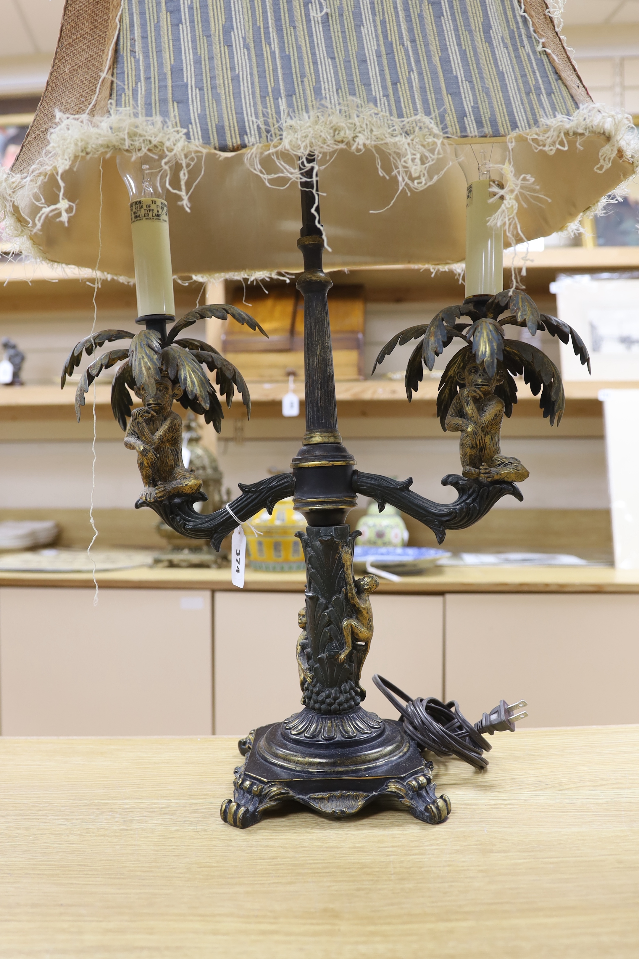 A pair of ornate brass sangerie lamps with shades, 78cm high